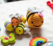 Colorful crocheted bee keychains and charms—perfect beginner projects from a crochet kit.