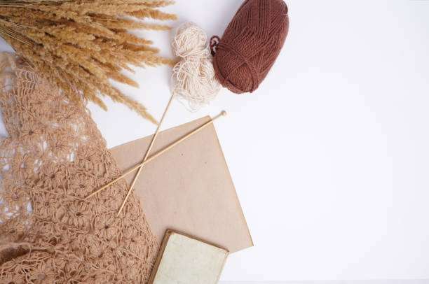 Warm fall crafting scene with yarn, needles, and crochet; perfect for a Crochet Kit.