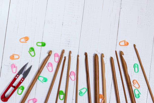Assortment of crochet hooks, stitch markers, and scissors for a comprehensive Crochet Kit.